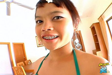 Little Thai beauty Meme gets a huge load of cum sprayed across her braces